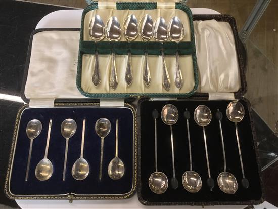 3 cased sets of spoons